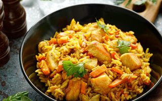 Pilaf or pilau with chicken, traditional uzbek hot dish of boiled rice